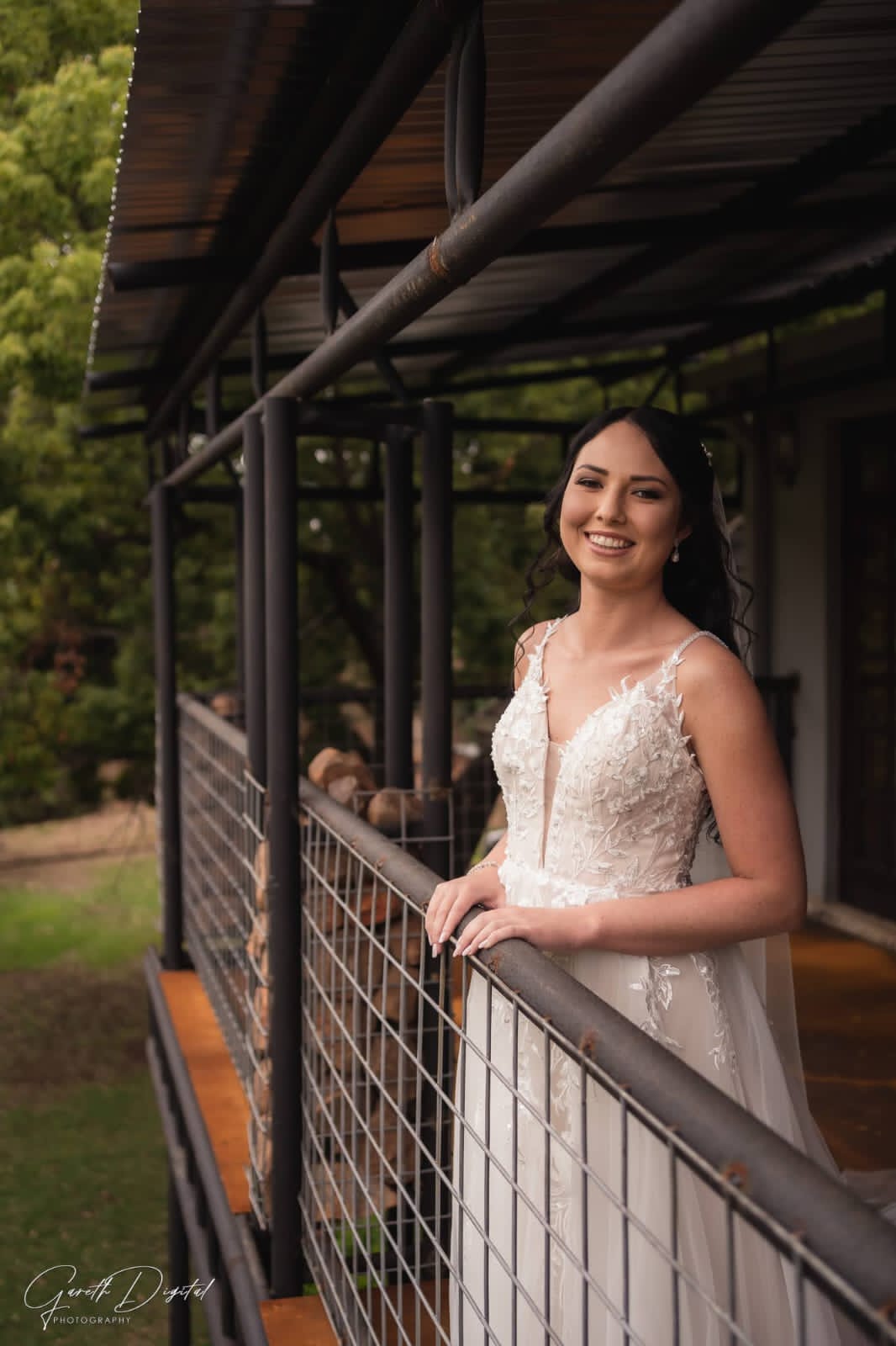 Pre-loved Rochell wedding gown featuring lace detailing and a flowing train