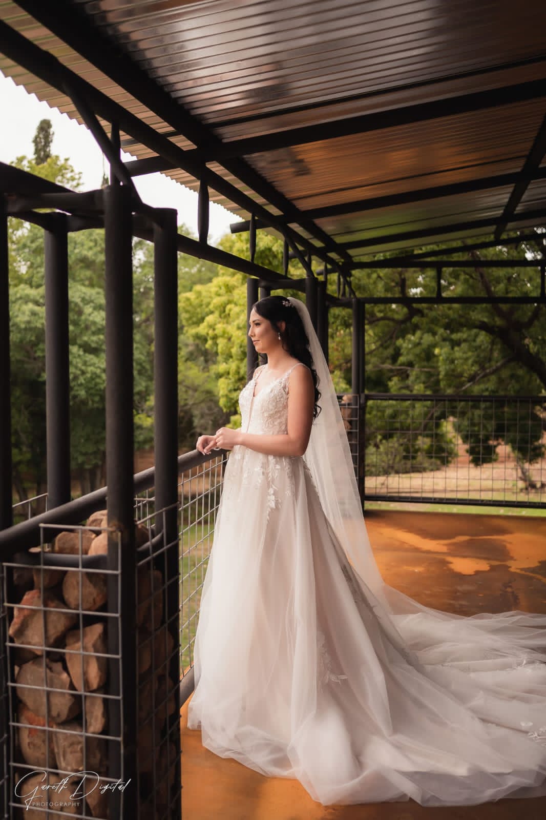 Pre-loved Rochell wedding gown featuring lace detailing and a flowing train