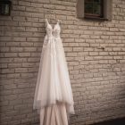 Pre-loved Rochell wedding gown featuring lace detailing and a flowing train