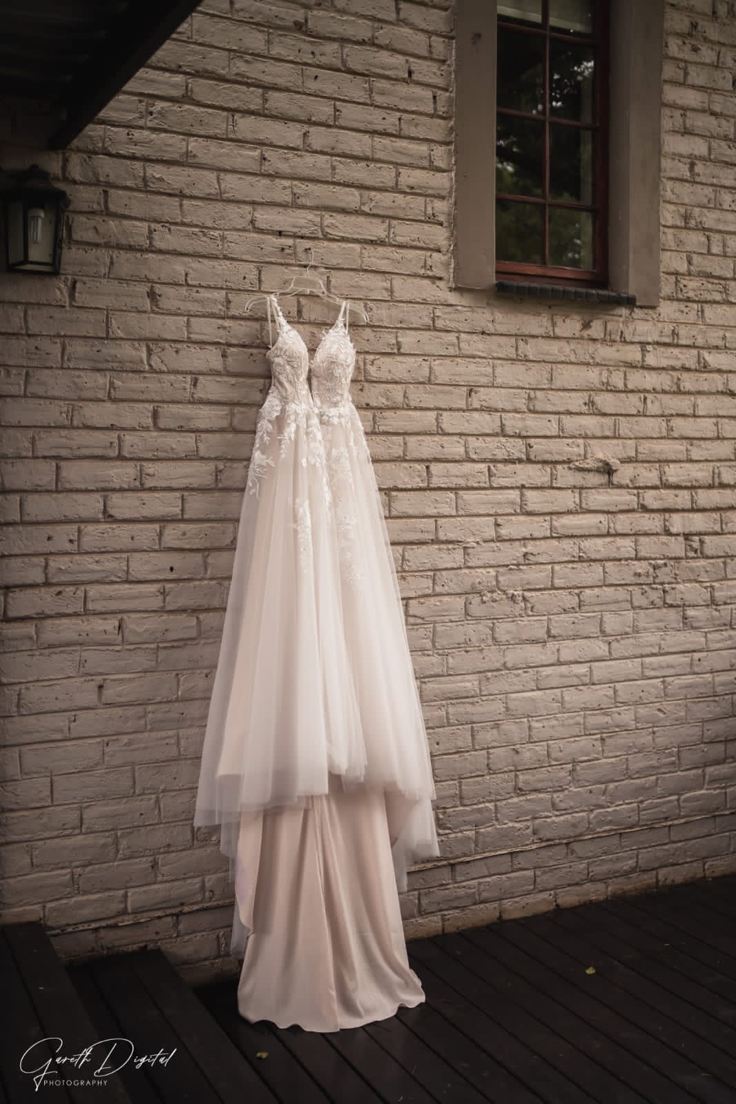 Pre-loved Rochell wedding gown featuring lace detailing and a flowing train
