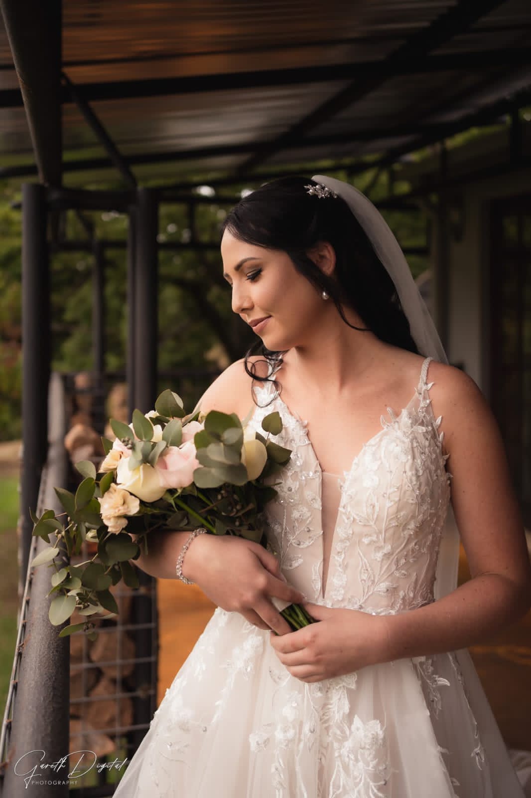 Pre-loved Rochell wedding gown featuring lace detailing and a flowing train