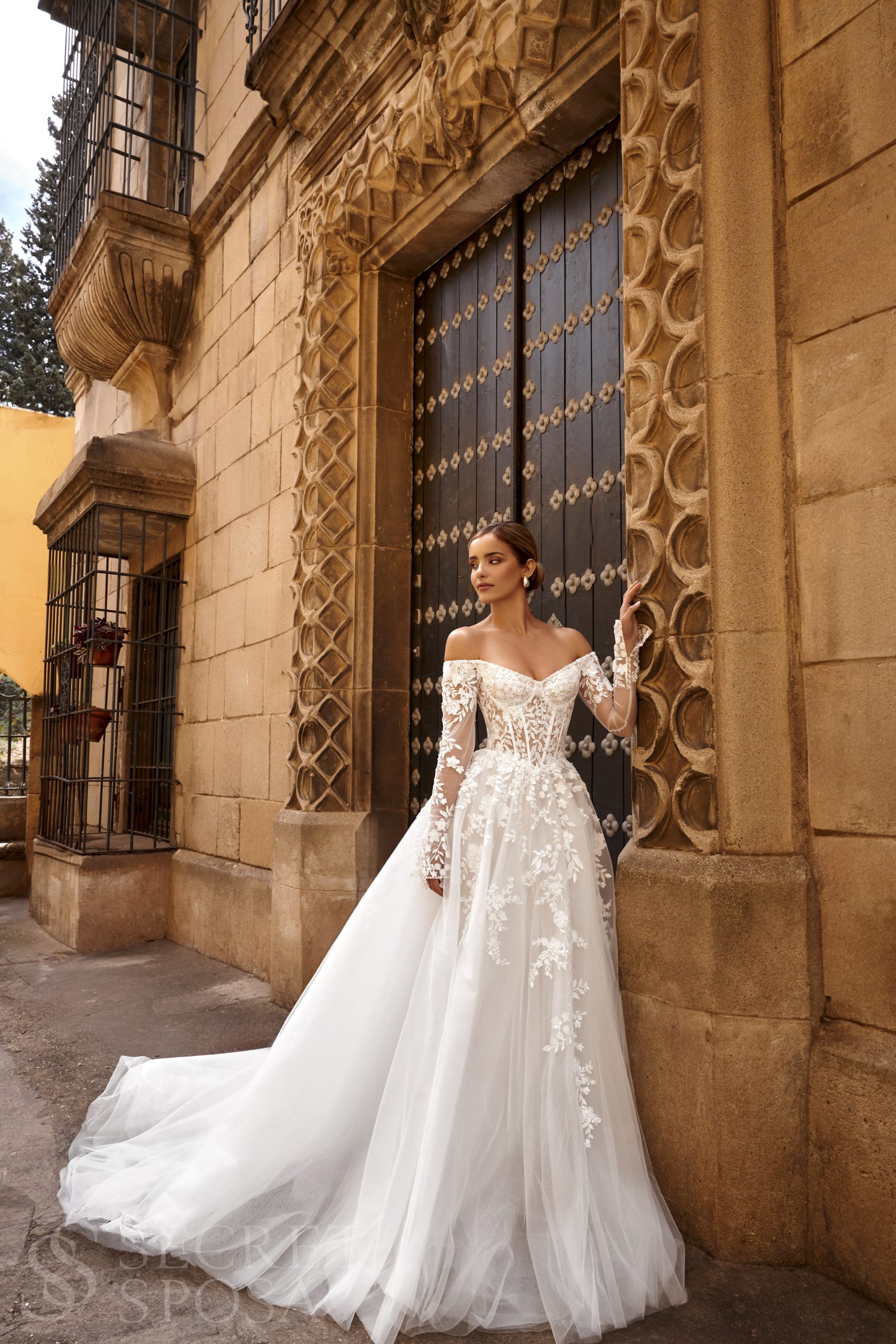 Gwendoline Wedding Gown Gwendoline wedding dress off-shoulder lace appliqué with long sheer sleeves and tulle skirt
