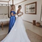 Bride wearing the Hannah romantic tulle A-line wedding dress with floral lace appliqués