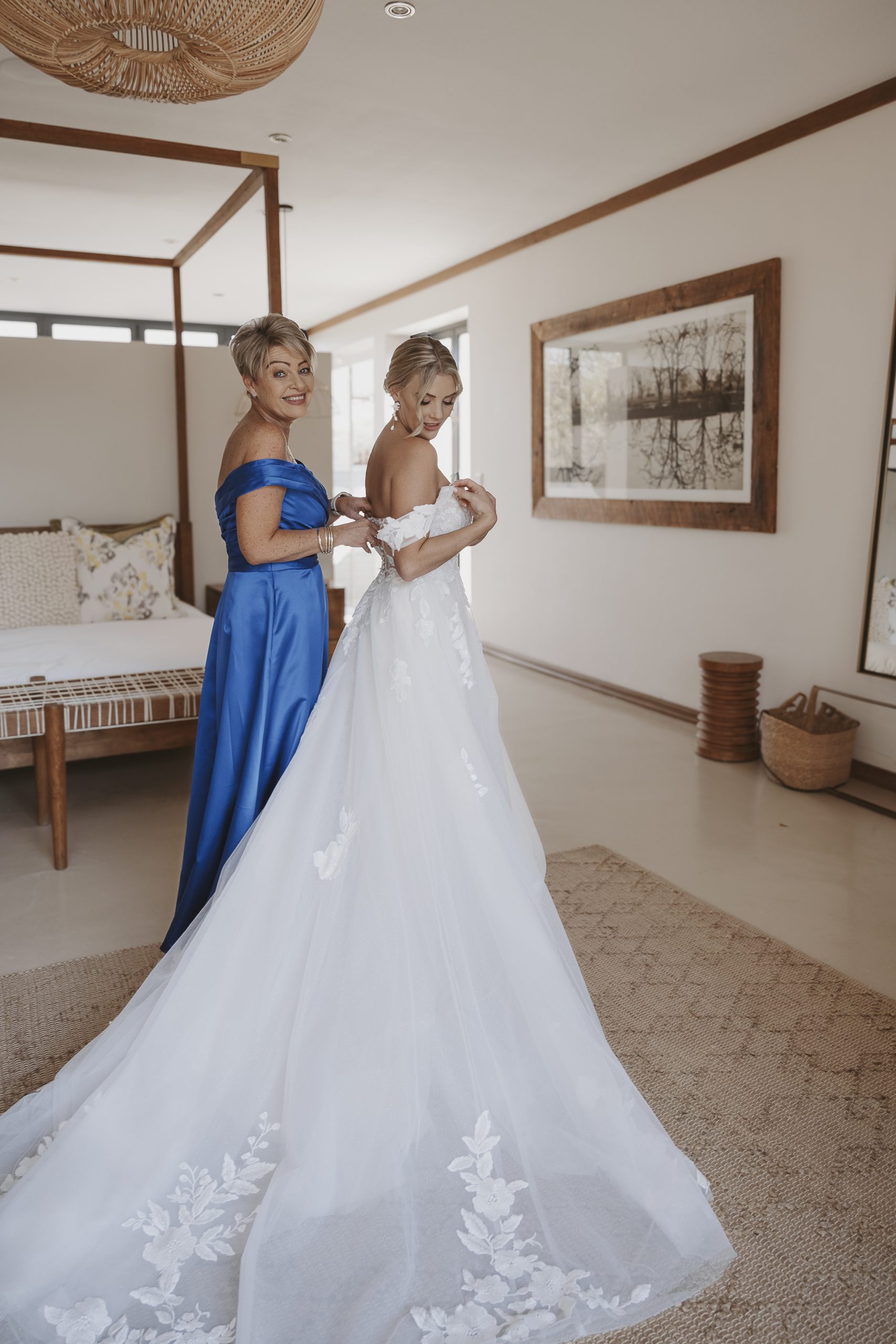 Bride wearing the Hannah romantic tulle A-line wedding dress with floral lace appliqués