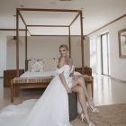 Bride wearing the Hannah romantic tulle A-line wedding dress with floral lace appliqués