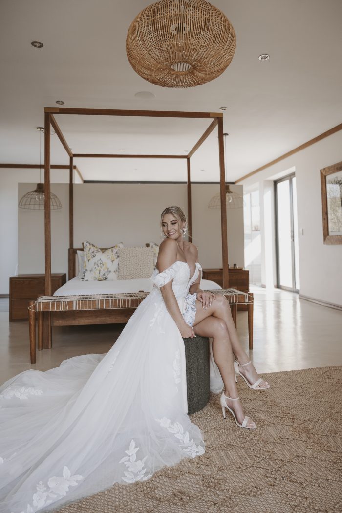 Bride wearing the Hannah romantic tulle A-line wedding dress with floral lace appliqués