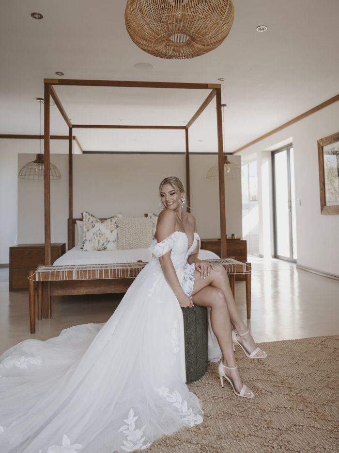 Bride wearing the Hannah romantic tulle A-line wedding dress with floral lace appliqués
