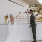 Bride wearing the Hannah romantic tulle A-line wedding dress with floral lace appliqués