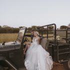 Bride wearing the Hannah romantic tulle A-line wedding dress with floral lace appliqués