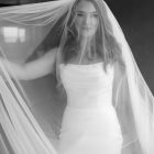 Lily satin strapless wedding dress with draped neckline and button-back detailing.