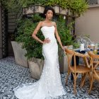 basque waist wedding dress with floral overskirt