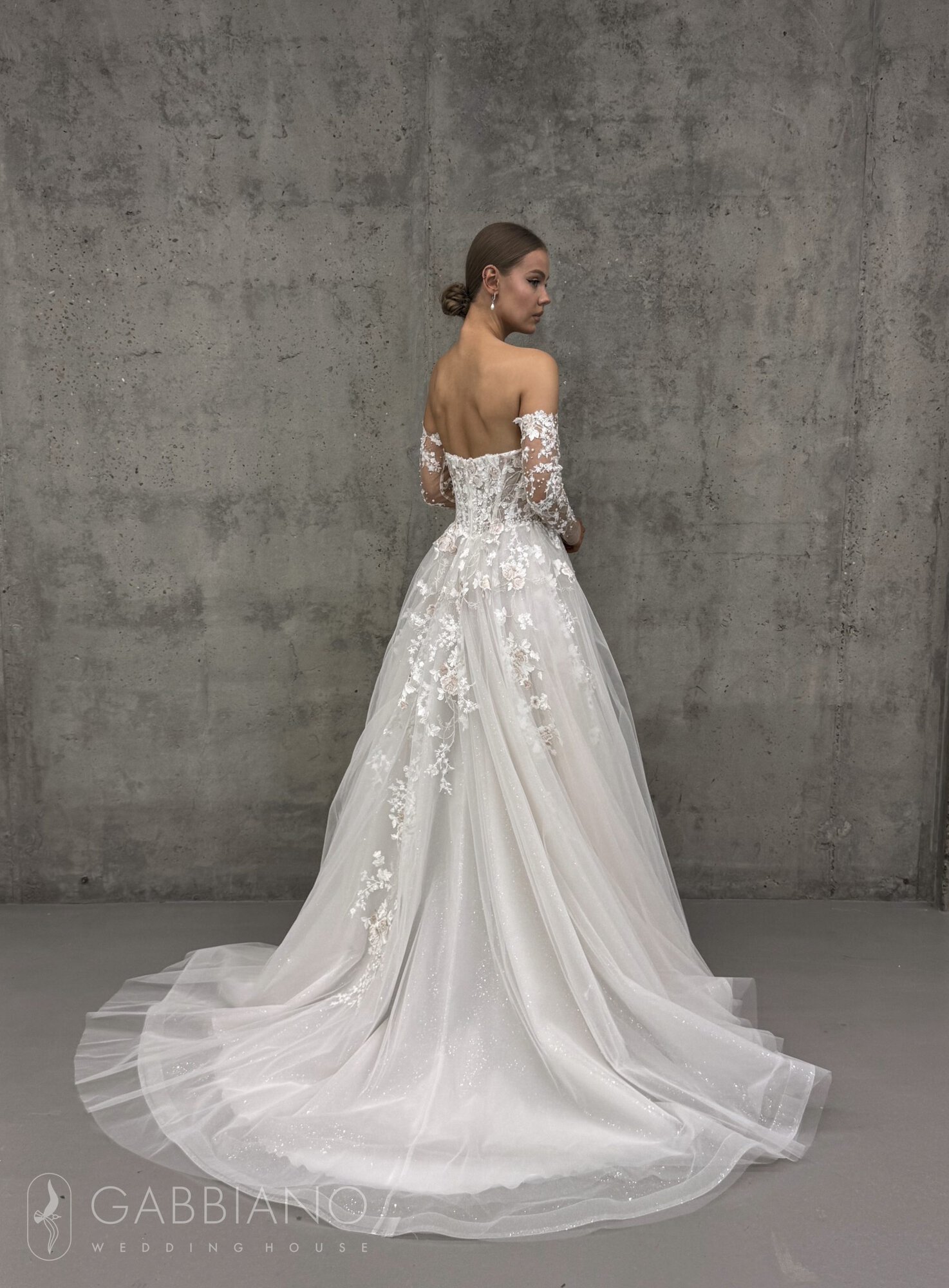 Back of Teddy wedding dress with lace bodice and sparkling train