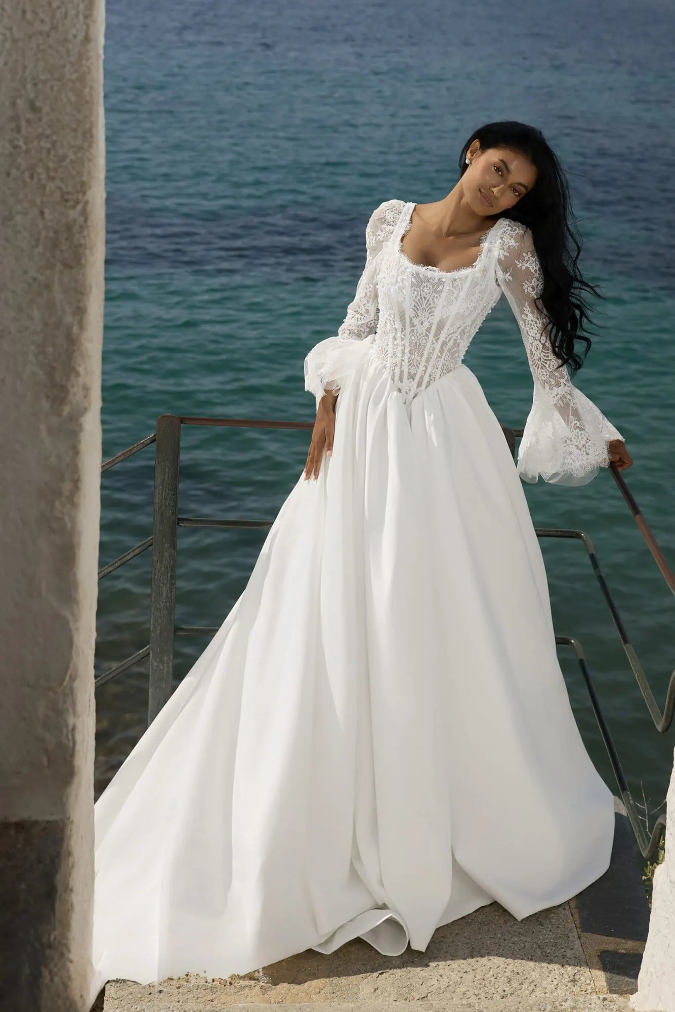 Polonso wedding gown with lace sleeves and flowing A-line skirt