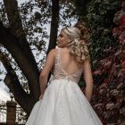 Back of April A-line wedding dress with open back and shimmering skirt