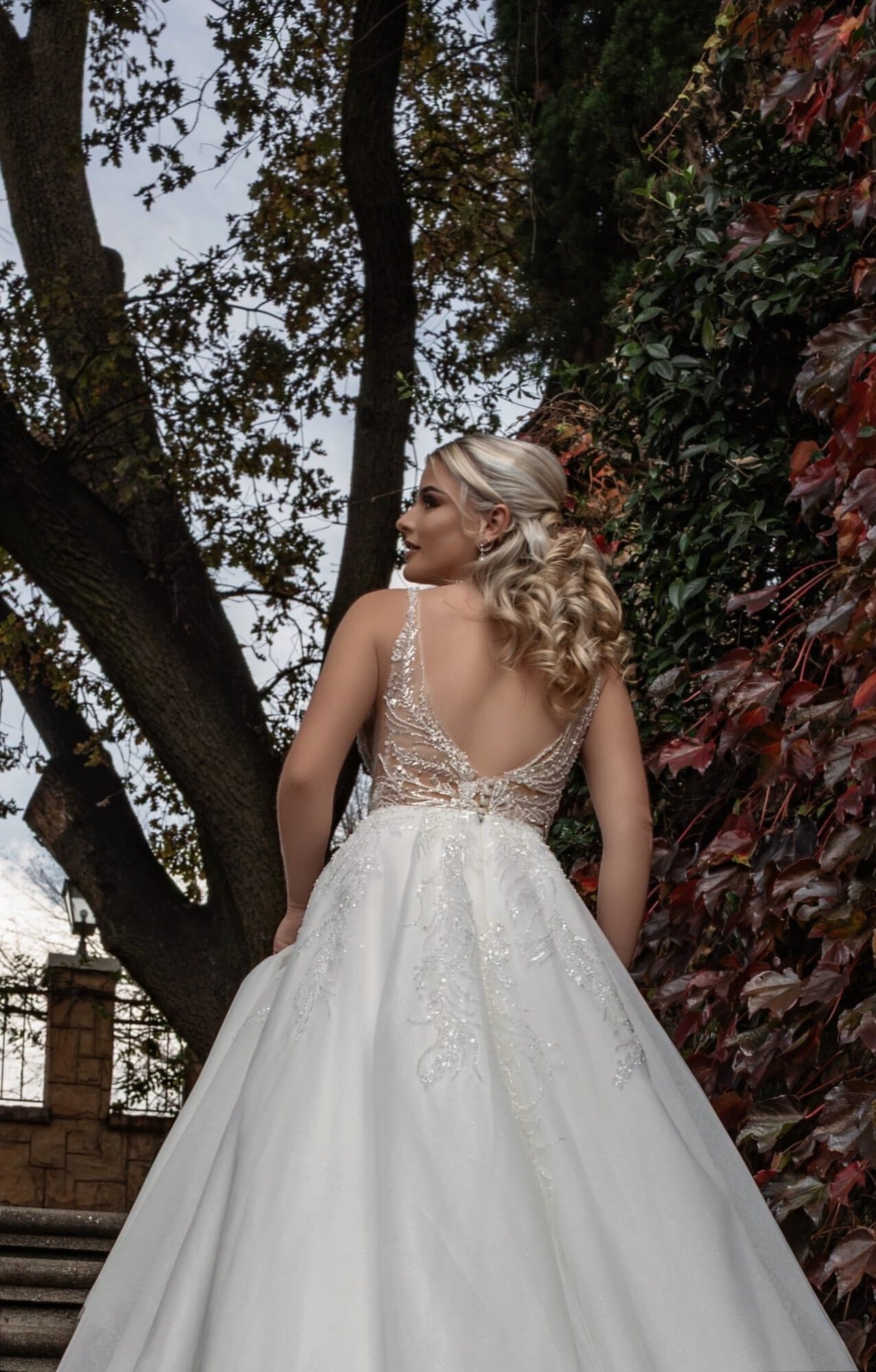 Back of April A-line wedding dress with open back and shimmering skirt