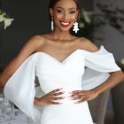 Anna bridal gown featuring a beautifully draped crepe bodice and statement billowing organza sleeves.